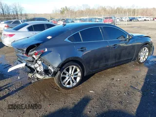 2014 Mazda 6 i Grand Touring with VIN JM1GJ1W50E1107877, listed as a IAAI auction lot 41857596 with 166,188 mi miles and . Bid and sale history available at DreamBid. Image 4.