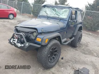 2003 Jeep Wrangler X with VIN 1J4FA39S23P300447, listed as a IAAI auction lot 41791733 with 165,576 mi miles. Bid and sale history available at carsss.com. Image 17.
