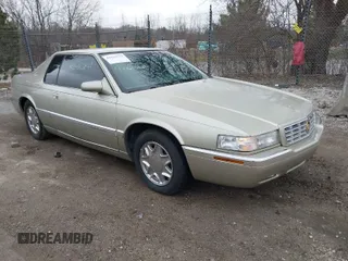 1997 Cadillac Eldorado ESC with VIN 1G6EL12Y8VU606820, listed as a IAAI auction lot 42010829 with 176,629 mi miles. Bid and sale history available at carsss.com. Image 1.