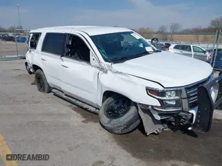 2020 Chevrolet Tahoe Commercial with VIN 1GNSKDEC5LR261015, listed as a IAAI auction lot 42001083 with 110,668 mi miles. Bid and sale history available at carsss.com. Image 1.
