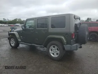 2007 Jeep Wrangler Unlimited Sahara z VIN 1J4GA59127L106988, wystawiony jako Copart lot #59750975 z przebiegiem 154 233 mil mil oraz Czysty tytuł • Clean title. Historia ofert i sprzedaży dostępna na DreamBid. Obrazek 2.
