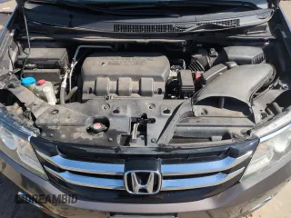 2014 Honda Odyssey Touring with VIN 5FNRL5H95EB052523, listed as a Copart auction lot 52214055 with 131,350 mi miles and Salvage Title. Bid and sale history available at DreamBid. Image 12.