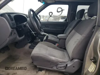 2000 Nissan Frontier XE with VIN 1N6ED27T8YC357939, listed as a Copart auction lot 55727395 with 143,842 mi miles and Salvage title. Bid and sale history available at DreamBid. Image 7.