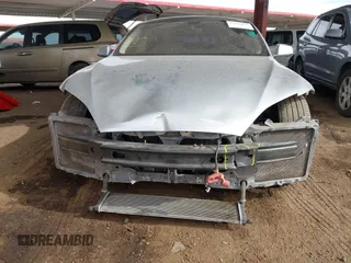2014 Tesla Model S 60 with VIN 5YJSA1H17EFP35351, listed as a IAAI auction lot 41558434 with 151,002 mi miles and . Bid and sale history available at DreamBid. Image 13.