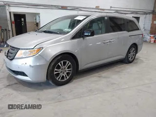 2012 Honda Odyssey EX z VIN 5FNRL5H47CB045705, wystawiony jako IAAI lot #42384430 z przebiegiem 157 598 mil mil oraz . Historia ofert i sprzedaży dostępna na DreamBid. Obrazek 2.