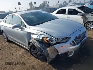 2018 Ford Fusion SE z VIN 3FA6P0H77JR188742, wystawiony jako IAAI lot #40873909 z przebiegiem 156 179 mil mil oraz . Historia ofert i sprzedaży dostępna na DreamBid. Obrazek 1.