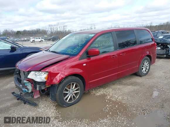 2014 Dodge Grand Caravan SE with VIN 2C4RDGBG6ER187868, listed as a IAAI auction lot 41949644 with 156,937 mi miles and . Bid and sale history available at DreamBid. Image 2.