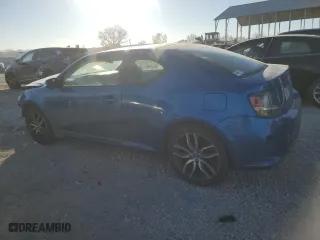 2015 Scion tC with VIN JTKJF5C72FJ012056, listed as a Copart auction lot 83813504 with 131,014 mi miles and Salvage Title. Bid and sale history available at carsss.com. Image 2.
