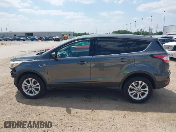 2017 Ford Escape SE z VIN 1FMCU0GD1HUE71410, wystawiony jako IAAI lot #42026516 z przebiegiem 173 804 mil mil oraz . Historia ofert i sprzedaży dostępna na DreamBid. Obrazek 15.
