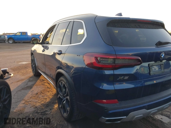 2021 BMW X5 sDrive40i with VIN 5UXCR4C01M9F02587, listed as a IAAI auction lot 41111144 with 23,844 mi miles. Bid and sale history available at carsss.com. Image 3.