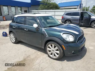 2013 MINI Countryman S with VIN WMWZC3C58DWP21965, listed as a Copart auction lot 61161735 with 142,797 mi miles and Salvage title. Bid and sale history available at DreamBid. Image 4.