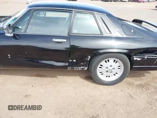 1989 Jaguar XJS with VIN SAJNA5840KC151334, listed as a IAAI auction lot 41702577 with 113,000 mi miles and . Bid and sale history available at DreamBid. Image 6.