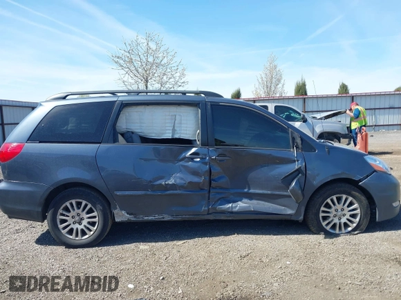 2009 Toyota Sienna XLE with VIN 5TDBK22C69S027767, listed as a IAAI auction lot 42029832 with 200,752 mi miles and . Bid and sale history available at DreamBid. Image 13.