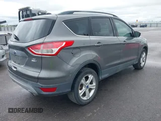 2014 Ford Escape SE with VIN 1FMCU9GX3EUB06947, listed as a IAAI auction lot 42193325 with 138,923 mi miles and . Bid and sale history available at DreamBid. Image 4.