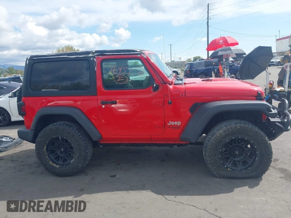 2019 Jeep Wrangler Sport S z VIN 1C4GJXAG4KW652569, wystawiony jako IAAI lot #42116457 z przebiegiem 46 007 mil mil oraz . Historia ofert i sprzedaży dostępna na DreamBid. Obrazek 14.