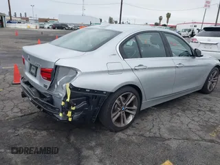 2017 BMW 3 Series 330e iPerformance with VIN WBA8E1C59HK480327, listed as a IAAI auction lot 41809395 with 74,919 mi miles. Bid and sale history available at carsss.com. Image 4.