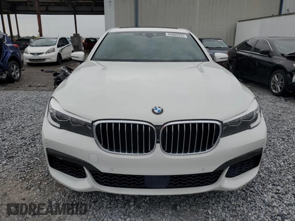 2016 BMW 7 Series 740i with VIN WBA7E2C52GG547112, listed as a Copart auction lot 63069355 with 76,867 mi miles and Salvage title. Bid and sale history available at DreamBid. Image 5.