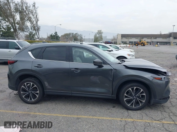 2022 Mazda CX-5 2.5 S Premium Plus Package with VIN JM3KFBEM1N0523105, listed as a IAAI auction lot 41730897 with 64,008 mi miles. Bid and sale history available at carsss.com. Image 13.
