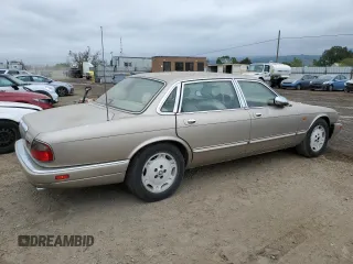 1997 Jaguar XJ Vanden Plas with VIN SAJKX6245VC800386, listed as a Copart auction lot 53651675 with 158,185 mi miles and Salvage Title. Bid and sale history available at DreamBid. Image 3.