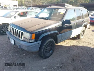 1998 Jeep Grand Cherokee Laredo with VIN 1J4FX58S7WC283734, listed as a IAAI auction lot 41267813 with 266,189 mi miles. Bid and sale history available at carsss.com. Image 2.