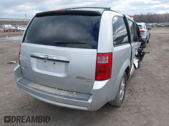 2010 Dodge Grand Caravan SXT with VIN 2D4RN5D13AR180609, listed as a IAAI auction lot 41857215 with Not Provided miles and . Bid and sale history available at DreamBid. Image 4.