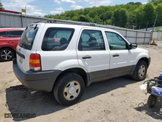 2003 Ford Escape XLS Popular with VIN 1FMYU92163KC43110, listed as a Copart auction lot 58699684 with 66,450 mi miles and Salvage Title. Bid and sale history available at carsss.com. Image 3.