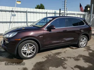 2014 Porsche Cayenne S Hybrid with VIN WP1AE2A24ELA51085, listed as a Copart auction lot 65040144 with 93,952 mi miles and Salvage title. Bid and sale history available at DreamBid. Image 1.