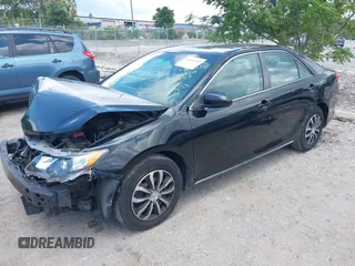 2014 Toyota Camry L with VIN 4T4BF1FKXER402857, listed as a IAAI auction lot 42144757 with 192,081 mi miles and . Bid and sale history available at DreamBid. Image 16.