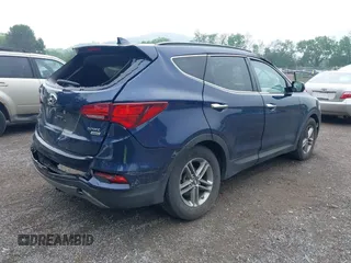 2017 Hyundai Santa Fe 2.4L z VIN 5XYZUDLB9HG421284, wystawiony jako IAAI lot #42441436 z przebiegiem 96 155 mil mil oraz . Historia ofert i sprzedaży dostępna na DreamBid. Obrazek 4.
