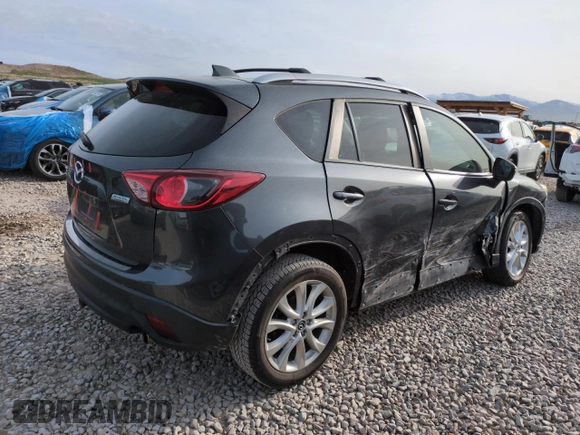 2015 Mazda CX-5 Grand Touring with VIN JM3KE4DY3F0495411, listed as a Copart auction lot 50077765 with 136,191 mi miles and Salvage Title. Bid and sale history available at DreamBid. Image 3.