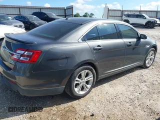 2015 Ford Taurus SEL with VIN 1FAHP2E87FG156969, listed as a IAAI auction lot 42506157 with 99,184 mi miles and . Bid and sale history available at DreamBid. Image 4.