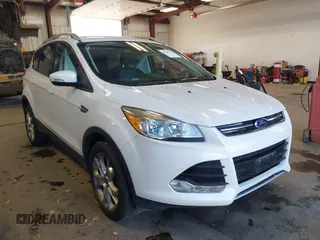 2016 Ford Escape Titanium with VIN 1FMCU9J94GUC28648, listed as a IAAI auction lot 42043761 with 82,509 mi miles. Bid and sale history available at carsss.com. Image 1.