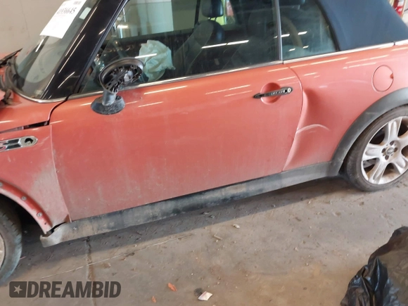 2005 MINI Convertible S with VIN WMWRH33455TK55035, listed as a IAAI auction lot 41936645 with 111,018 mi miles and . Bid and sale history available at DreamBid. Image 13.