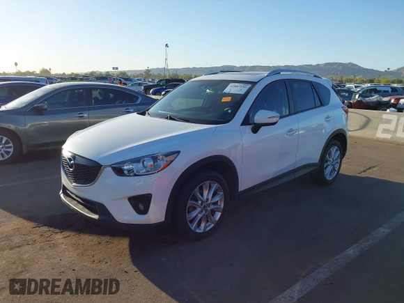 2015 Mazda CX-5 Grand Touring with VIN JM3KE2DYXF0493370, listed as a IAAI auction lot 42087156 with 161,464 mi miles. Bid and sale history available at carsss.com. Image 2.