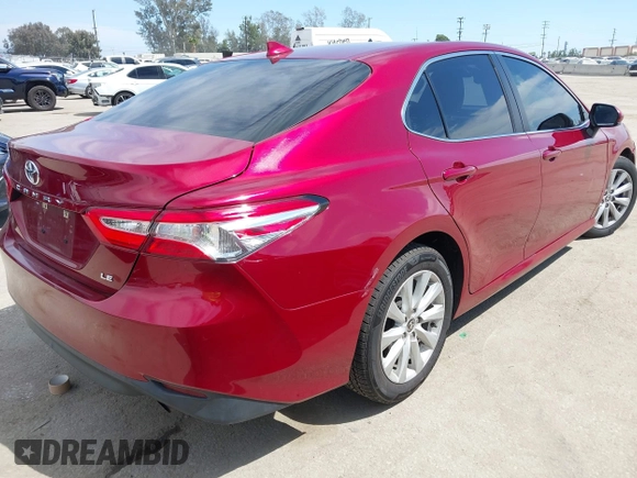 2020 Toyota Camry LE with VIN 4T1C11AK9LU991305, listed as a IAAI auction lot 41976371 with 57,422 mi miles and . Bid and sale history available at carsss.com. Image 4.