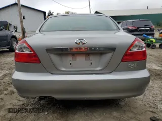 2002 Infiniti Q45 z VIN JNKBF01A52M002920, wystawiony jako Copart lot #73249364 z przebiegiem 95 955 mil mil oraz Tytuł czysty. Historia ofert i sprzedaży dostępna na DreamBid. Obrazek 6.