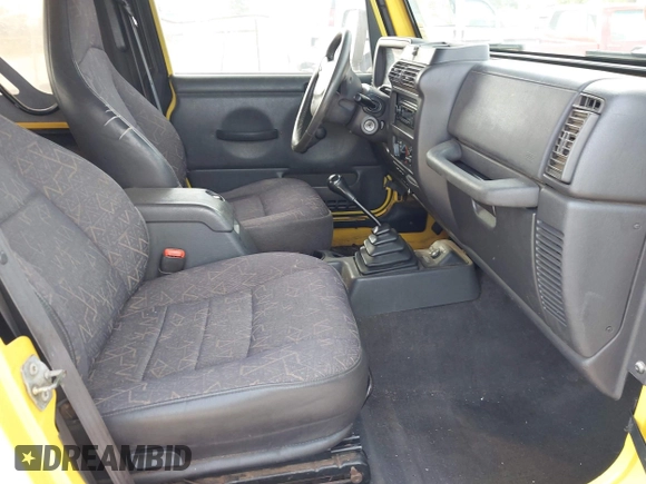 2002 Jeep Wrangler X z VIN 1J4FA39S82P719241, wystawiony jako IAAI lot #42150742 z przebiegiem 147 914 mil mil oraz . Historia ofert i sprzedaży dostępna na DreamBid. Obrazek 5.