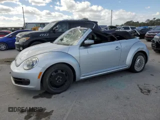 2014 Volkswagen Beetle 1.8T w/Premium z VIN 3VW517AT2EM813958, wystawiony jako Copart lot #76662504 z przebiegiem 71 841 mil mil oraz Szkoda całkowita • Salvage title. Historia ofert i sprzedaży dostępna na DreamBid. Obrazek 1.