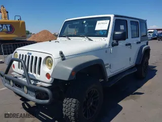 2010 Jeep Wrangler Unlimited Sport with VIN 1J4BA3H1XAL102159, listed as a IAAI auction lot 40190164 with 262,194 mi miles. Bid and sale history available at carsss.com. Image 2.