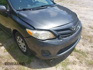 2011 Toyota Corolla L with VIN 2T1BU4EE0BC680158, listed as a IAAI auction lot 42060987 with 131,669 mi miles. Bid and sale history available at carsss.com. Image 6.