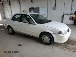 1999 Mazda Protege DX z VIN JM1BJ2224X0173126, wystawiony jako Copart lot #57389245 z przebiegiem 155 534 mil mil oraz Szkoda całkowita • Salvage title. Historia ofert i sprzedaży dostępna na DreamBid. Obrazek 4.
