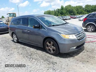 2011 Honda Odyssey Touring with VIN 5FNRL5H99BB062287, listed as a IAAI auction lot 42554645 with 308,185 mi miles and . Bid and sale history available at DreamBid. Image 1.