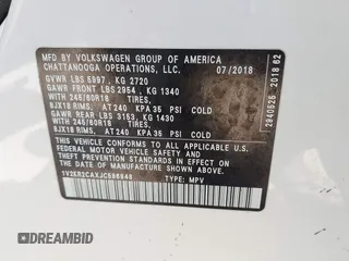 2018 Volkswagen Atlas SE with VIN 1V2KR2CAXJC586848, listed as a IAAI auction lot 42200959 with 96,336 mi miles and . Bid and sale history available at DreamBid. Image 9.