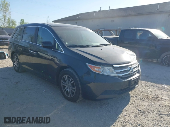 2012 Honda Odyssey EX-L with VIN 5FNRL5H6XCB016801, listed as a IAAI auction lot 42112141 with 164,671 mi miles and . Bid and sale history available at carsss.com. Image 1.