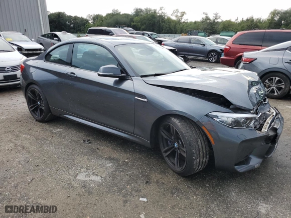 2018 BMW M2 with VIN WBS1J5C58J7B61965, listed as a Copart auction lot 63543004 with 9,663 mi miles and Salvage Title. Bid and sale history available at carsss.com. Image 4.