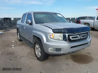 2010 Honda Ridgeline RTS with VIN 5FPYK1F42AB001593, listed as a IAAI auction lot 41015444 with 135,221 mi miles. Bid and sale history available at carsss.com. Image 1.