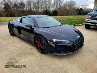 2021 Audi R8 z VIN WUAKBAFX4M7901384, wystawiony jako Copart lot #44935945 z przebiegiem 5665 mil mil oraz Tytuł czysty. Historia ofert i sprzedaży dostępna na DreamBid. Obrazek 1.