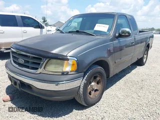 2002 Ford F-150 XL with VIN 1FTRX17W22NA43571, listed as a IAAI auction lot 42697861 with Not provided miles and . Bid and sale history available at DreamBid. Image 2.