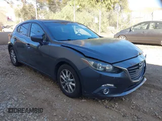2014 Mazda 3 i Grand Touring with VIN JM1BM1M77E1119529, listed as a IAAI auction lot 41399739 with 126,931 mi miles and . Bid and sale history available at DreamBid. Image 1.