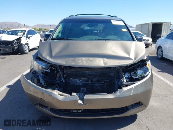 2012 Honda Odyssey EX-L z VIN 5FNRL5H63CB033049, wystawiony jako IAAI lot #42260501 z przebiegiem 165 693 mil mil oraz . Historia ofert i sprzedaży dostępna na DreamBid. Obrazek 13.